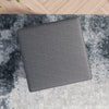 The Amber Square Upholstered Ottoman in Dark Grey